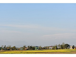 Mountains, Mustard field and the nearby village